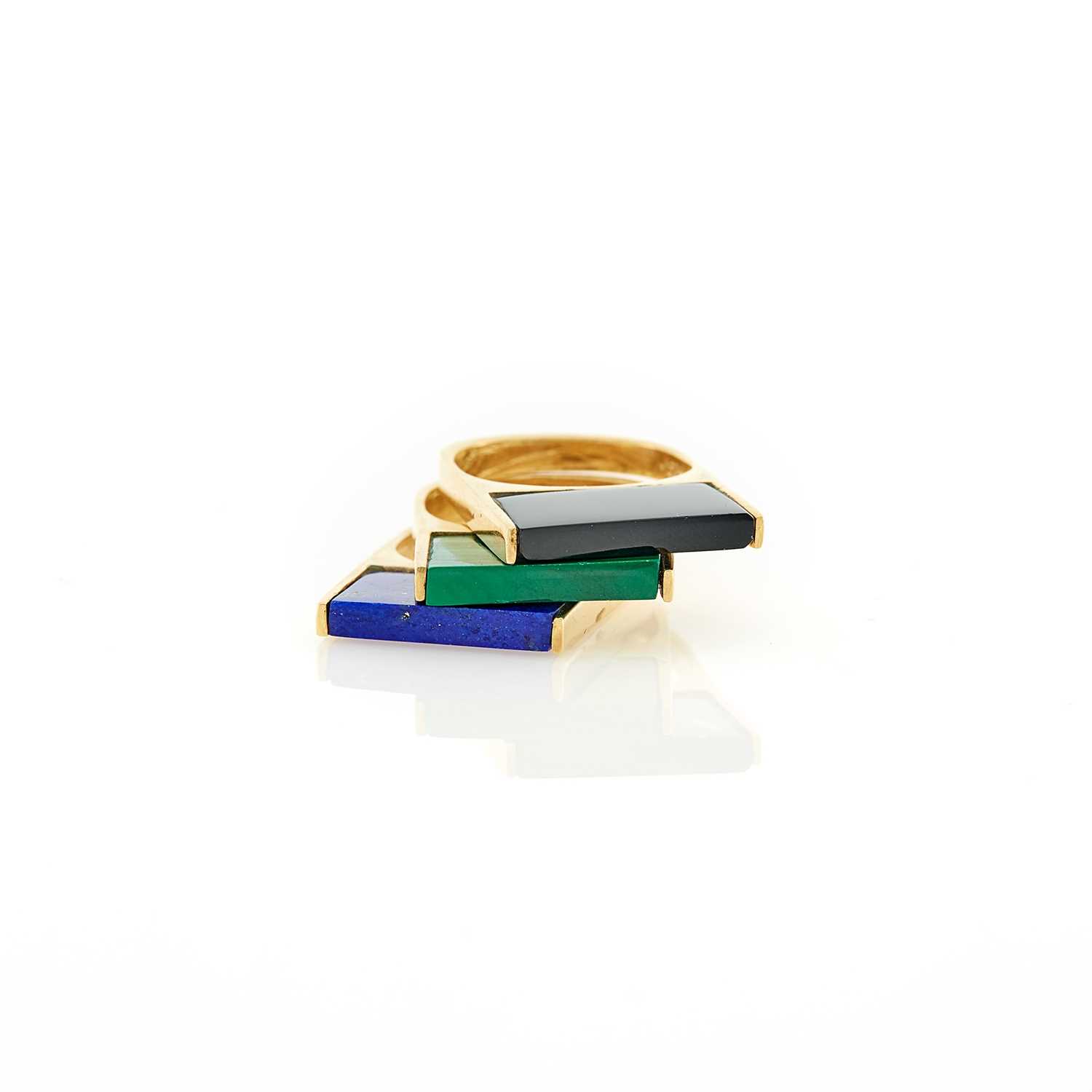 Lot 1008 - Three Gold, Lapis, Malachite and Black Onyx Rings