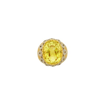 Lot 1243 - Mario Buccellati Two-Color Gold and Synthetic Yellow Sapphire Ring