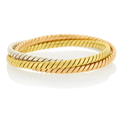 Lot 113 - Three Interlocking Rose, White and Yellow Gold Bangle Bracelets