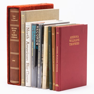 Lot 210 - Nine big game hunting record books, including the Safari Club, the Boone and Crockett club, and more