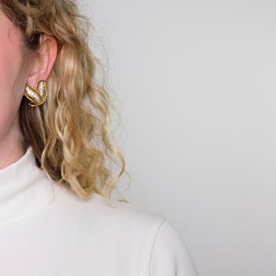 Lot 66 - Van Cleef & Arpels Pair of Gold, Platinum and Diamond Flare Earclips