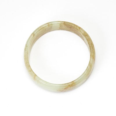 Lot 58 - A Chinese Russet Jade Bangle