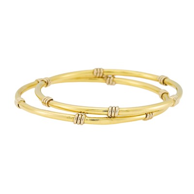 Lot 2037 - Pair of Two-Color Gold Bangle Bracelets