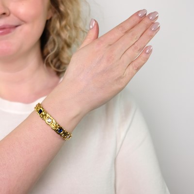 Lot 80 - Tiffany & Co. Art Nouveau Gold, Diamond and Sapphire Bangle Bracelet