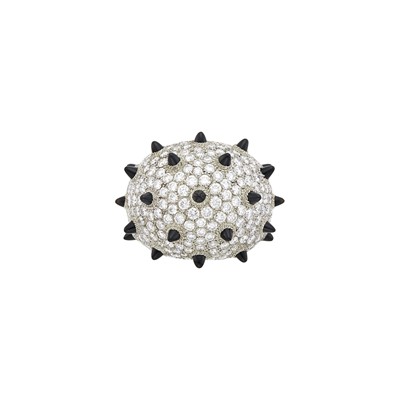 Lot 112 - Cartier White Gold, Diamond and Black Onyx 'Clash [Un]limited' Dome Ring, France