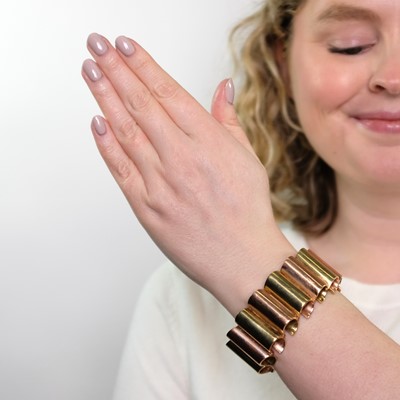 Lot 77 - Wide Two-Color Gold Scroll Bracelet