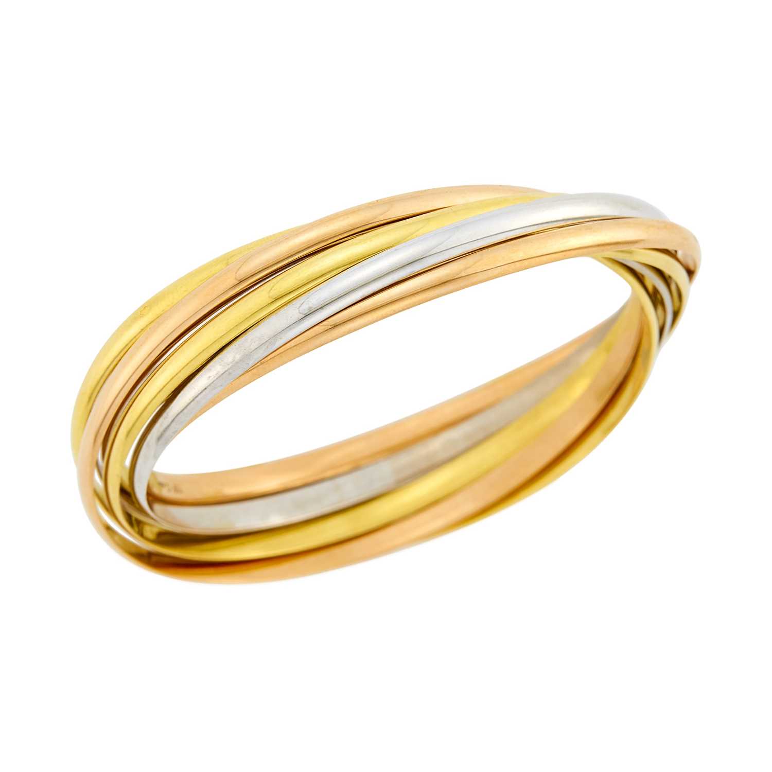Lot 51 - Cartier Tricolor Gold Seven Band 'Trinity' Rolling Bangle Bracelet, France