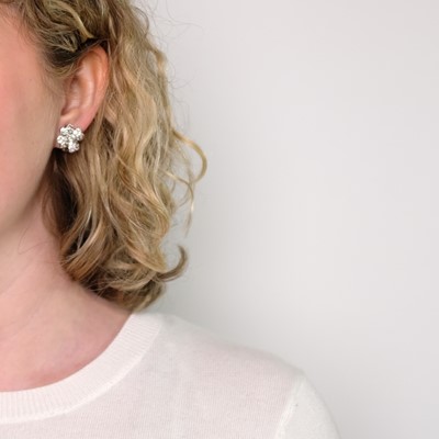 Lot 130 - Van Cleef & Arpels Pair of Platinum and Diamond 'Cosmos' Flower Earclips