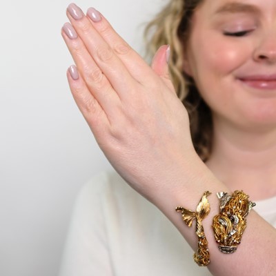 Lot 57 - Ilias Lalaounis for Zolotas Two-Color Gold, Diamond and Ruby Fish Bangle Bracelet