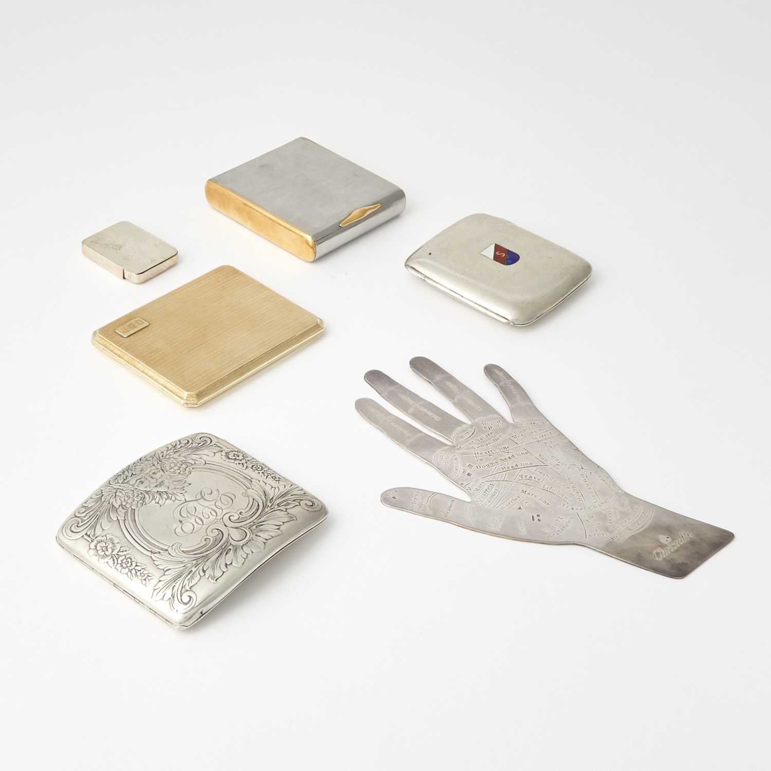 Lot 198 - A 14kt Gold Cigarette Case, Christofle Silver Plated Palmistry Hand, and Three Cigarette Cases