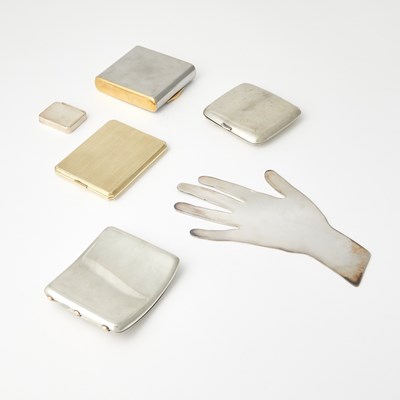 Lot 198 - A 14kt Gold Cigarette Case, Christofle Silver Plated Palmistry Hand, and Three Cigarette Cases
