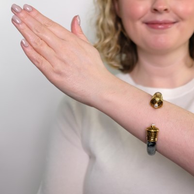 Lot 17 - Cartier Gold, Jade, Cultured Pearl and Black Enamel Bangle Bracelet, France