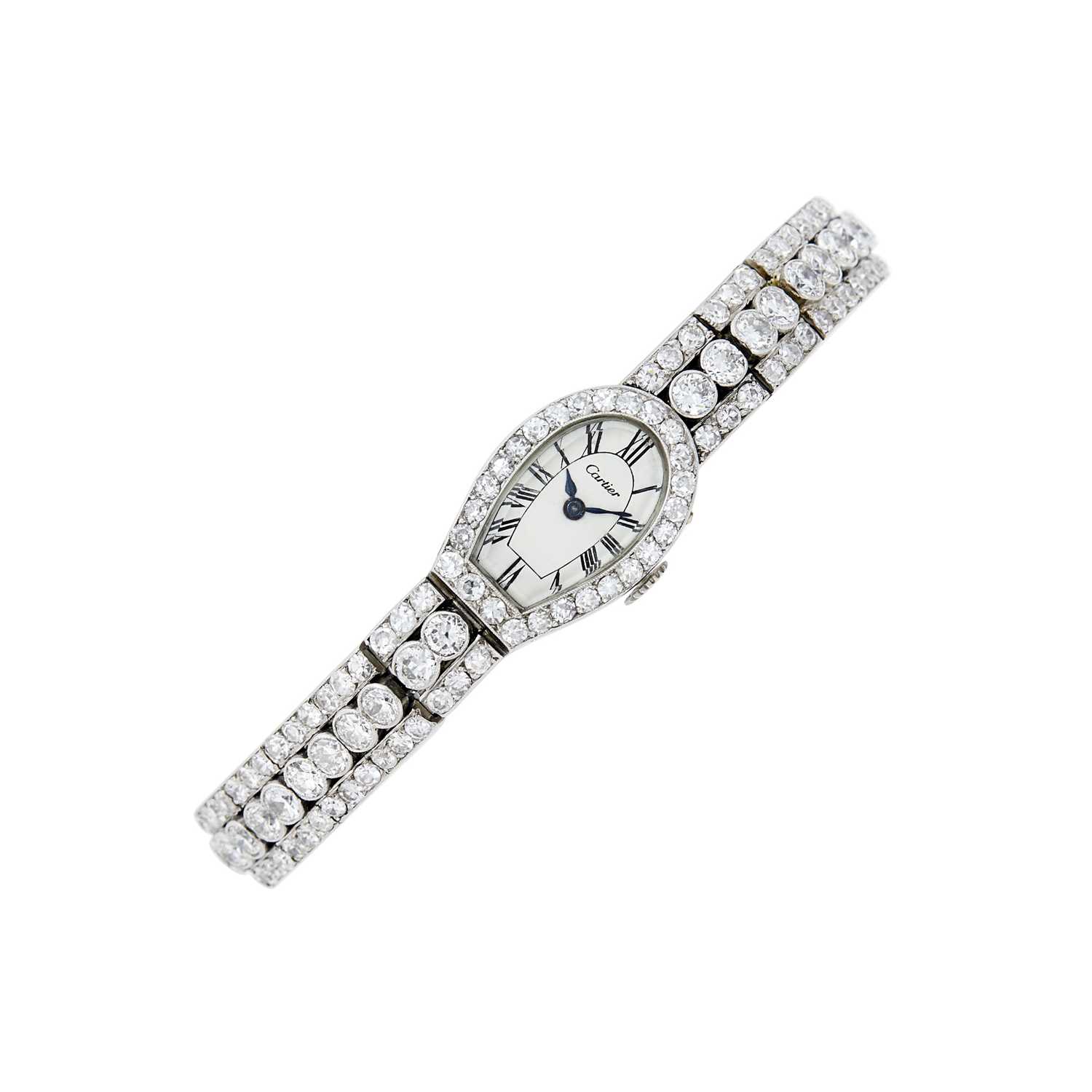 Lot 135 - Cartier Platinum, Gold and Diamond Wristwatch, France