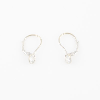 Lot 62 - Two Diamond Solitaire Earrings about 1.90 cts., 14K 1 dwt., stone damaged