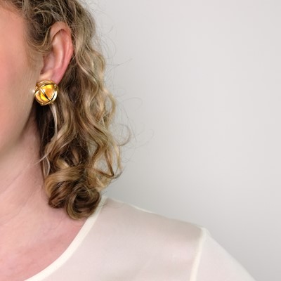 Lot 60 - Verdura Pair of Gold and Rock Crystal 'Caged' Earclips