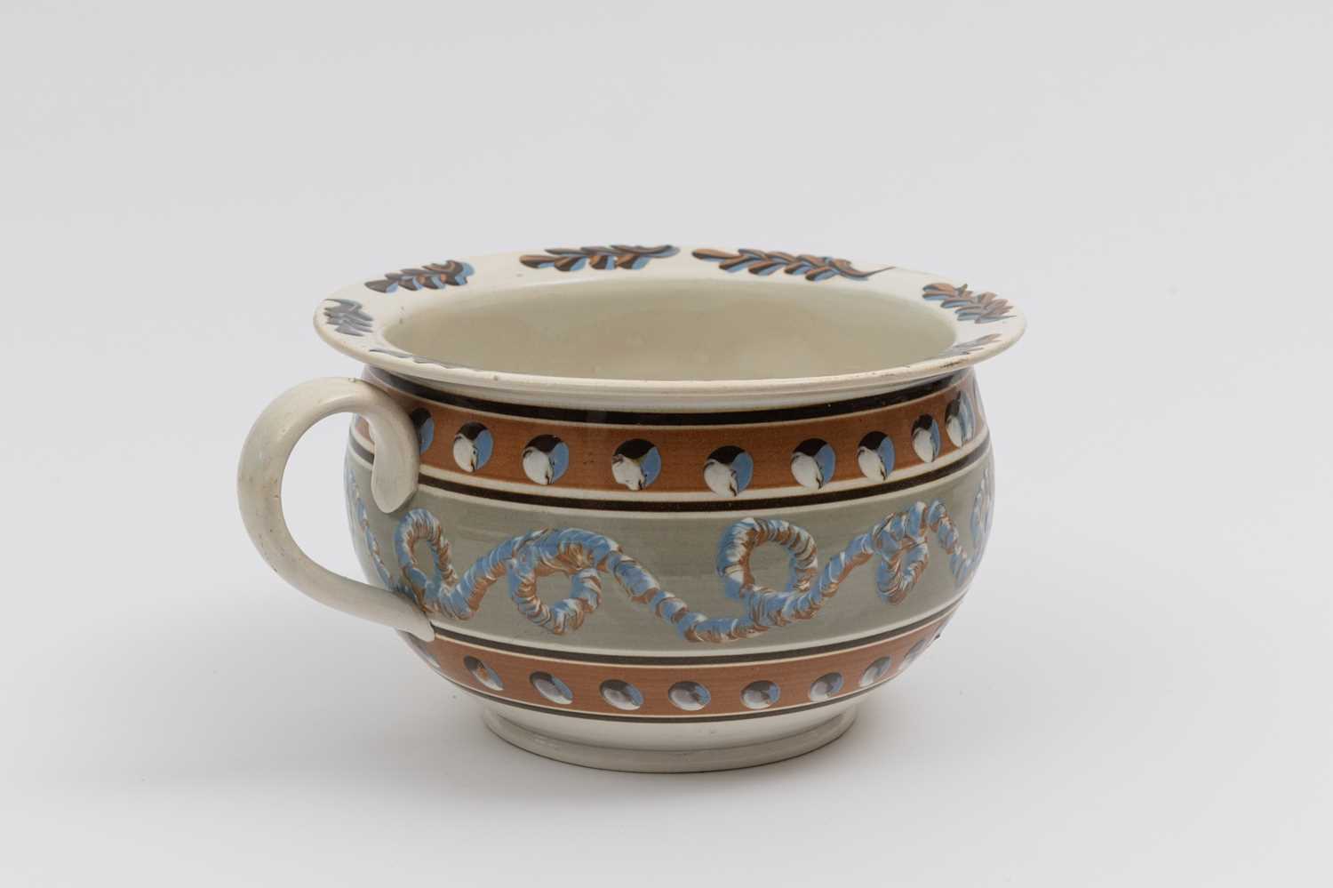 Lot 1079 - Slip-decorated Creamware Chamberpot