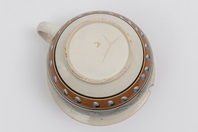 Lot 1079 - Slip-decorated Creamware Chamberpot