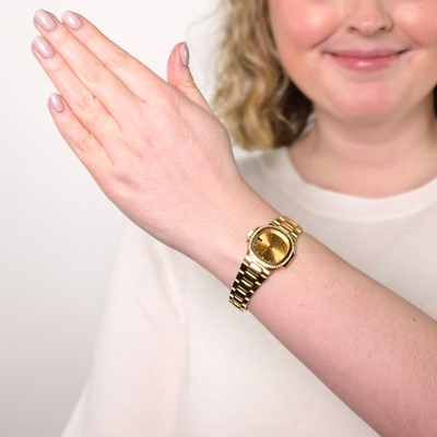 Lot 30 - Patek Philippe Gold and Diamond 'Nautilus' Wristwatch, Ref. 4700/2
