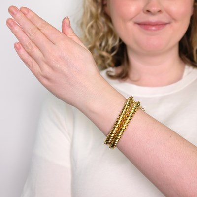 Lot 1027 - Pair of Fluted Gold Bangle Bracelets