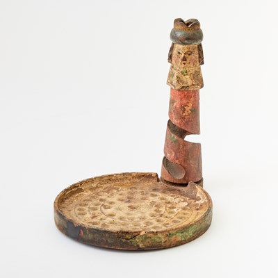 Lot 122 - A whimsical carved and painted wood game of chance in the form of a chess king