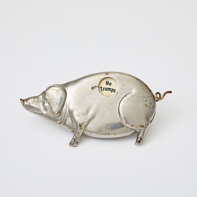 Lot 379 - A whimsical silvered pig-form playing card suite indicator