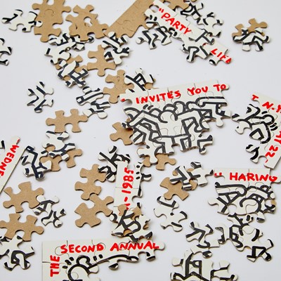 Lot 325 - A Keith Haring puzzle invitation to the 1985 "Party of Life"