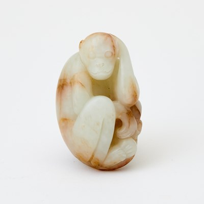 Lot 61 - A Chinese White Jade Carving of a Monkey