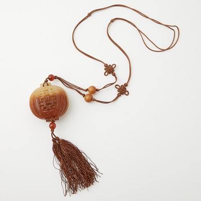 Lot 67 - A Small Chinese Russet Jade Sachet