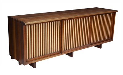 Lot 799 - George Nakashima Walnut and Pandanus Cloth Sliding Three-Door Cabinet