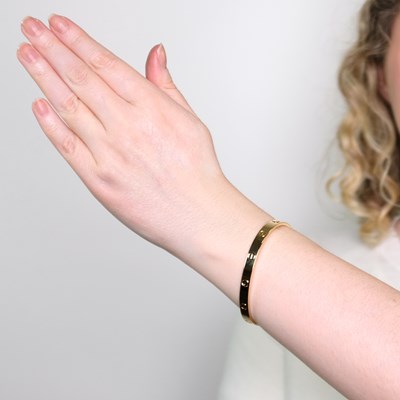 Lot 63 - Cartier Gold 'Love' Bangle Bracelet