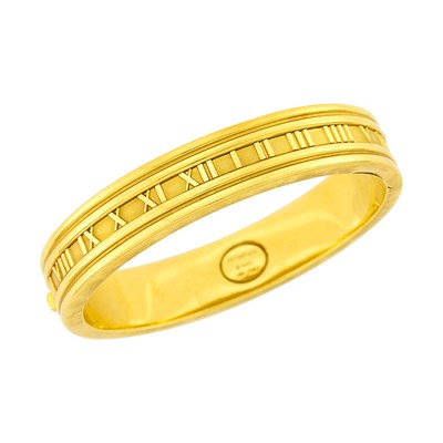 Lot 1014 - Tiffany & Co. Gold 'Atlas' Bangle Bracelet