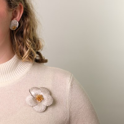 Lot 59 - Buccellati White and Rose Gold Flower Clip-Brooch and Pair of Two-Color Gold Petal Earrings