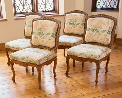 Lot 147 - Set of Four Régence Upholstered Walnut Side Chairs