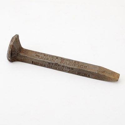 Lot 684 - A Souvenir Gold Spike from Cecil B. DeMille's "Union Pacific"