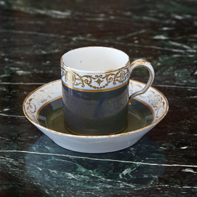 Lot 447 - Sèvres Porcelain (Hard Paste) Gray-Ground (Fond Merde D'Oie) Cup and Saucer (Gobelet Litron)