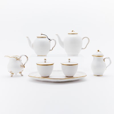 Lot 482 - FIVE VINCENNES AND SEVRES PORCELAIN GILT WHITE TEAWARES AND FOUR SEVRES FEUILLE-DE-CHOUX PLATES