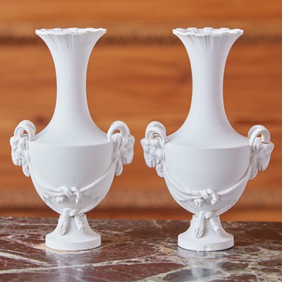 Lot 476 - PAIR OF SEVRES BISCUIT PORCELAIN RAM’S HEAD HANDLED VASES (VASES ‘BOUC DU BARRY’)