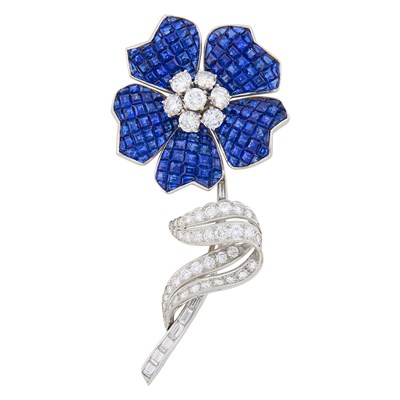 Lot 233 - Platinum, Invisibly-Set Sapphire and Diamond Flower Clip-Brooch, France
