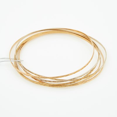 Lot 111 - Six Gold Rigid Bracelets, 14K 9 dwt., damaged