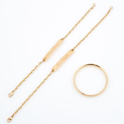 Lot 556 - Three Gold ID Bracelets, 14K 8 dwt.