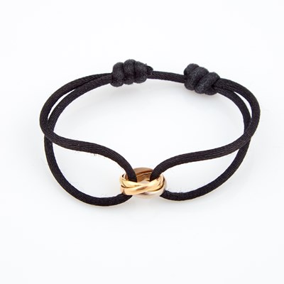 Lot 583 - Gold and Cord Bracelet, 18K 2 dwt. all, bears signature Cartier