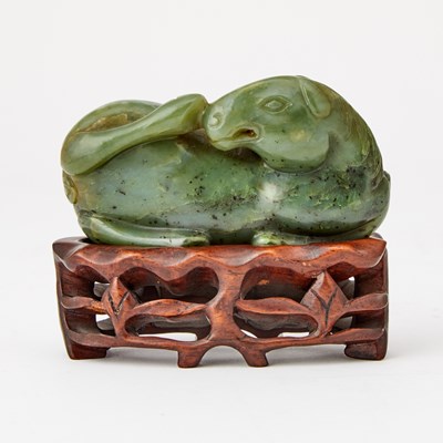 Lot 76 - A Chinese Spinach Jade Carving of a Recumbent Horse