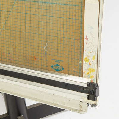 Lot 453 - Al Jaffee's drafting table, side table, and a group of his art supplies from his studio