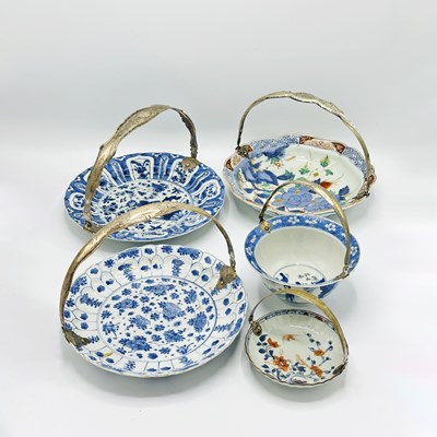 Lot 1065 - Five Chinese and Japanese Blue and White or Imari Porcelain Plates with Silver Swing Handles