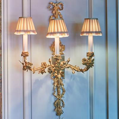 Lot 158 - Set of Six Louis XVI Style Gilt Metal Floriform Three-Light Sconces