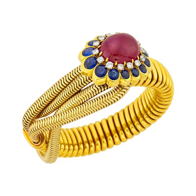 Lot 186 - Cartier Gold, Cabochon Ruby, Sapphire and Diamond Tubogas Loop Bracelet, France