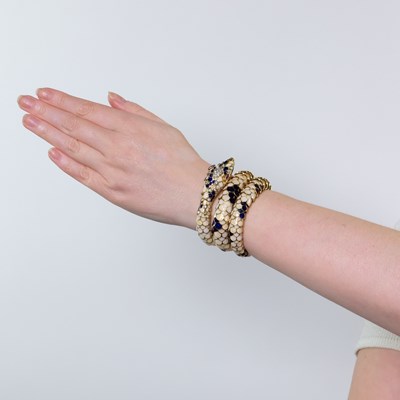 Lot 55 - Gold, Enamel, Diamond and Ruby Coiled Serpent Bracelet