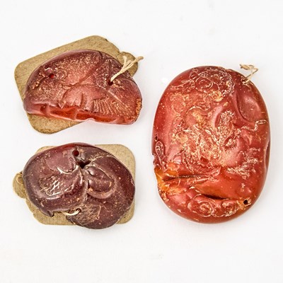Lot 560 - Three Chinese Carved Amber Articles