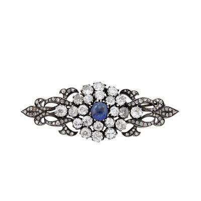 Lot 1061 - Silver, Gold, Cabochon Sapphire and Diamond Brooch