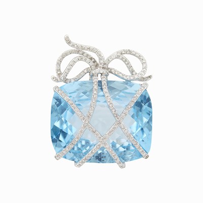 Lot 1044 - White Gold, Blue Topaz and Diamond Bow Brooch